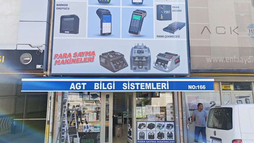 AGT Bilgi Sistemleri logolu mavi tente